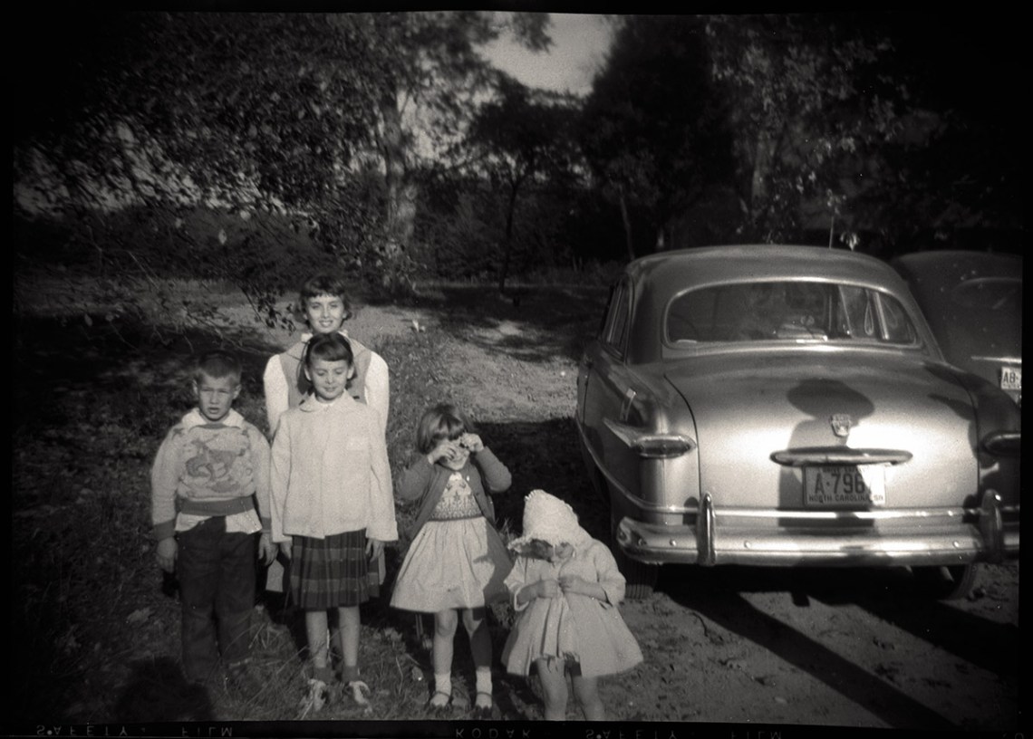 Children by car, North Carolina, 1958.